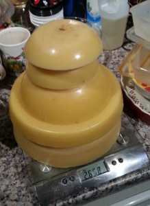 A tower of wax blocks shaped by bowls, sitting on a scale showing 2.68kg